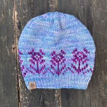 Load image into Gallery viewer, Luxury women&#39;s hand knit winter pom beanie light blue purple flowers color wool slow fashion gift
