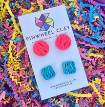 Load image into Gallery viewer, Beautiful polymer clay stud earrings set in hot pink and blue, inspired by the intricate art of knitting