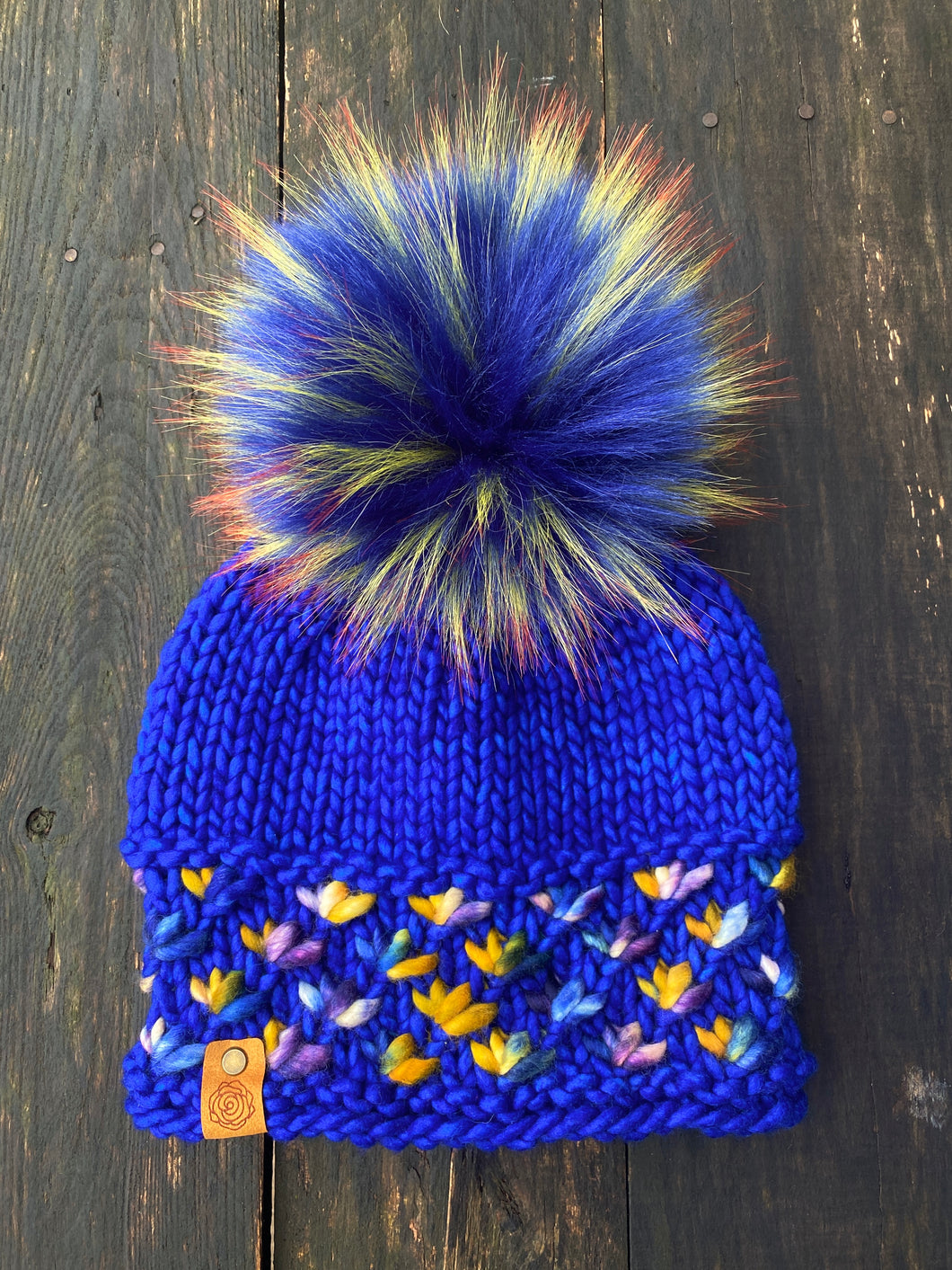 MADE TO ORDER Fun and funky blue with firey long yellow with orange tipped tips faux fur pom pom with wooden button